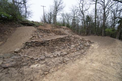 Terraced Spectator Area next to a Drop and Rock Garden